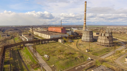 Obraz premium Aerial view of industrial steel plant. Aerial sleel factory. Flying over smoke steel plant pipes. Environmental pollution. Smoke.