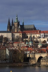 Fototapeta premium panoramic view over the Vlatave River, Charles Bridge and Prague Castle with the Cathedral Veitsdom