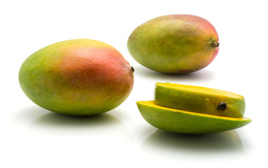 Sliced mango isolated on white background two whole two slices.