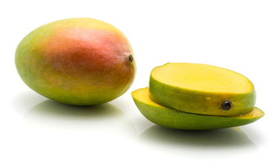 Sliced mango isolated on white background one whole two slices.