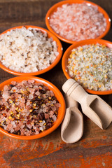 Fototapeta na wymiar Variety of sea salt, pink Himalayan salt, colorful salt with dried chili pepper, herbs and spices.