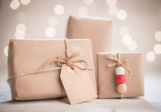 Gift boxes with tag on bokeh background