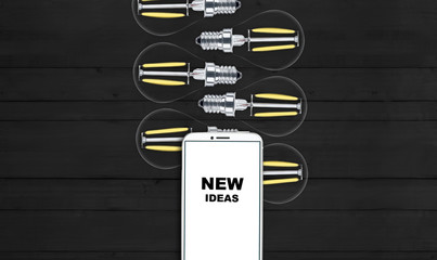 new ideas. telephone on the table and light bulbs. background for ideas - 181538979