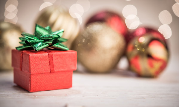 Holiday greeting card, red handmade gift box and christmas balls