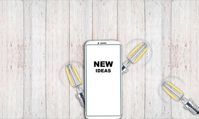 new ideas. telephone on the table and light bulbs. background for ideas - 181539362
