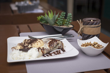 Sweet chocolate pancakes and ice cream romantic restaurant