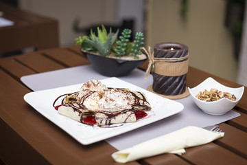 Sweet chocolate pancakes and ice cream romantic restaurant