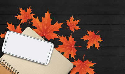 notebook, phone are lying on a wooden table with yellow, autumn leaves - 181541310
