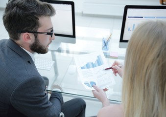 close-up of the company's employees work with financial information