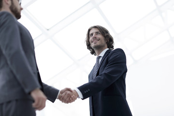 Fototapeta premium Close up image of business handshake at meeting.