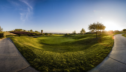 Sunrise at the golf course with views of the fairway and sidewalk