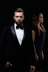 gentleman with his girl posing in the studio