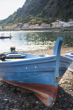boats moored on shore