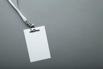 Empty card ID for the event / badge with a belt on a gray background.