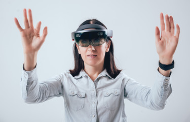 Woman wearing augmented reality goggles.