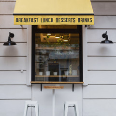 Cafe for breakfast, lunch and dinners. terrace view with tables and chairs.