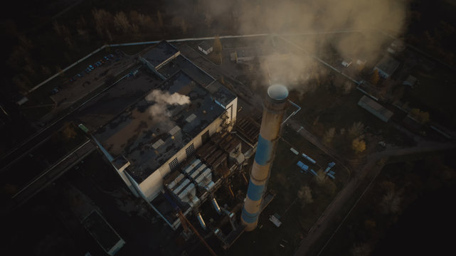 Garbage incineration plant. Waste incinerator plant with smoking smokestack. The problem of environmental pollution by factories.