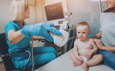 Doctor and little boy patient. Ultrasound equipment. Diagnostics. Sonography.