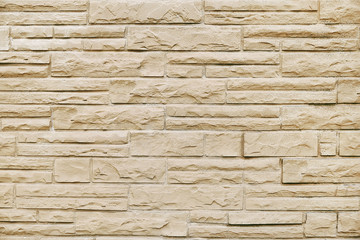 Old beige stone wall background texture