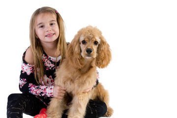 Pretty young girl hugging her cocker spaniel puppy