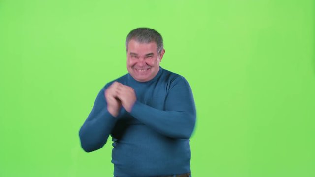 Middle aged man is happy. Green sreen