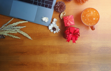 Place of work with laptop computer christmas decorate and cup of coffee , work on holidays concept, soft focus and vintage color tone process