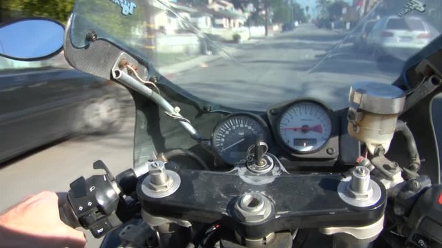 POV, motorcycle speeds on roadway