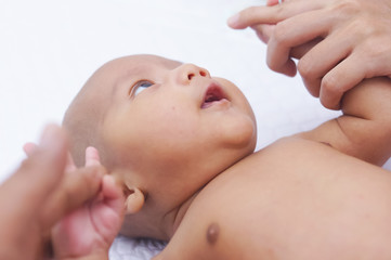 Asian Baby Boy Lying On Bed