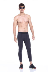 Fototapeta premium Full body length portrait of a young man wearing fitness sporty outfit