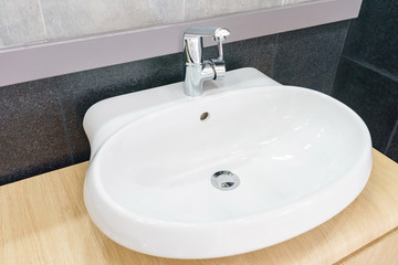 Interior of bathroom with sink basin faucet and mirror. Modern design of bathroom