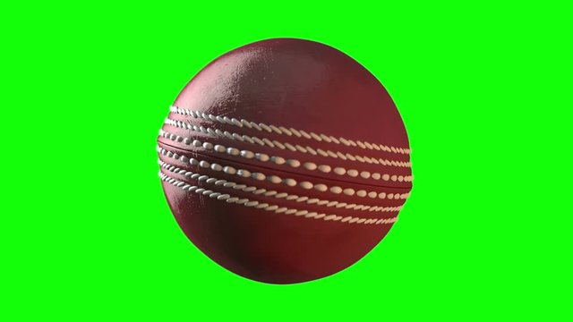 A loop able animation of a red cricket ball spinning in slow motion on a green screen background