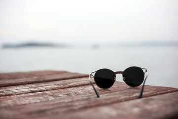 Fototapeta na wymiar Fashion sunglasses on sea beach