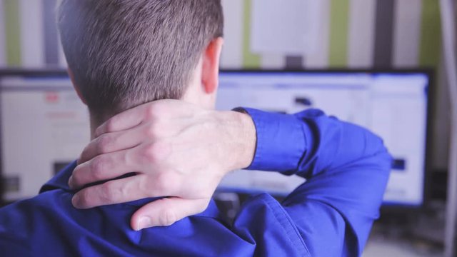 Man behind PC having neck pain 4K