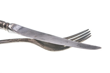 Vintage knife and fork on white background