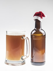 glass bottle of beer with Santa hat