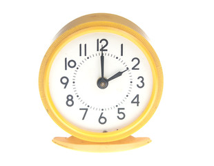 Yellow alarm clock isolated on white background