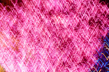 Shake the camera at numerous lights at night to create an abstract-looking night surface.
