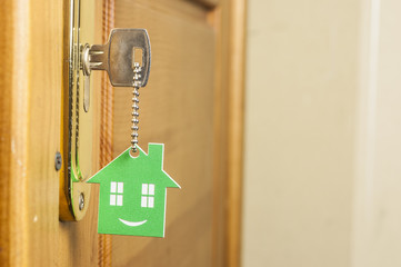 A key in a lock with house icon on it