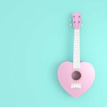 Ukulele sweet pink heart love concept on a green pastel color