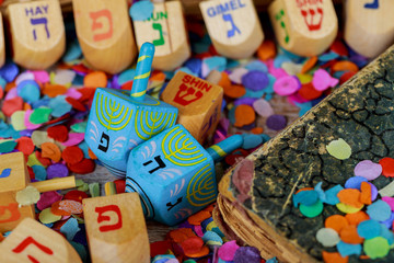 Dreidels for Hanukkah on wooden table