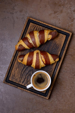 Two chocolate croissant and cup coffee