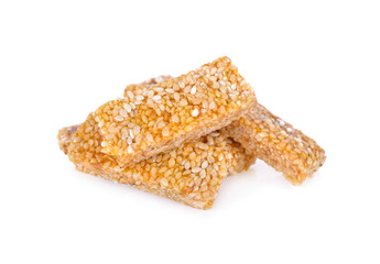 stack of sweetened white sesame stick on background