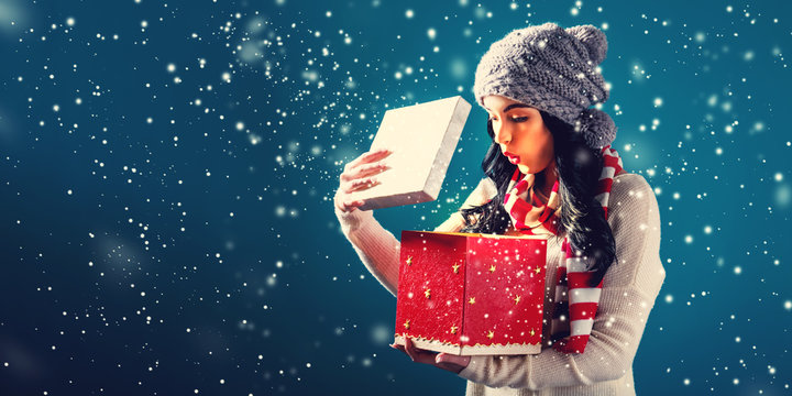 Happy Young Woman Opening A Christmas Present Box