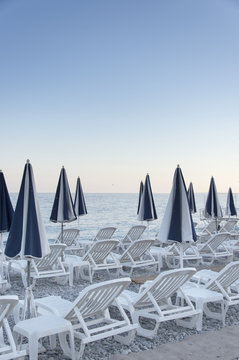 Sunset, Beach Club With Empty Sunbeds In South France