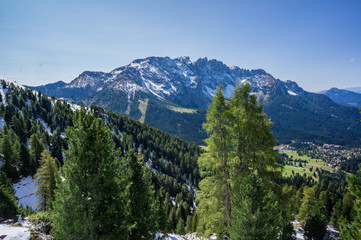 Snow mountains and green valley at summer sunny day. Dolomites Alps, Rosengarden Group, South Tirol, Italy.