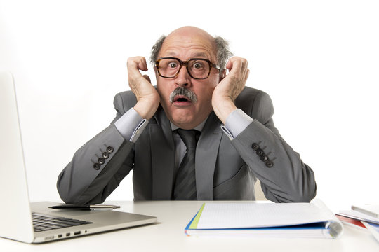 Mature Business Man With Bald Head On His 60s Working Stressed And Frustrated At Office Computer Laptop Desk Looking Desperate