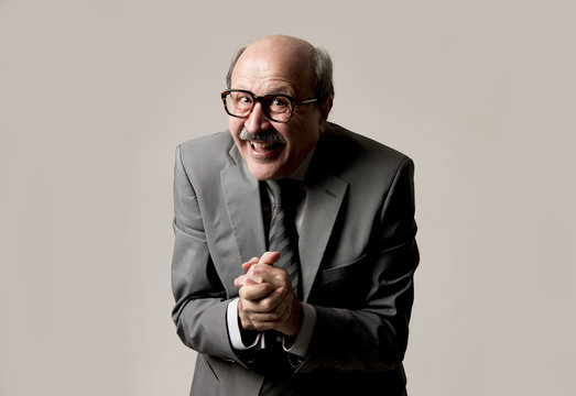 portrait of happy and excited senior mature business man on his 60s gesturing spastic and satisfied in business success and fun