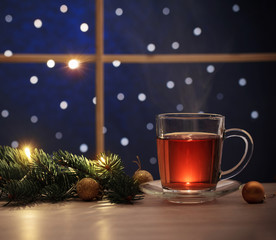 cup of tea  on background night window