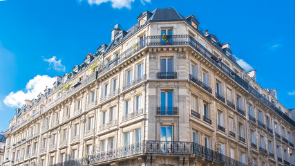 Paris, typical facade in the Marais, beautiful building 
