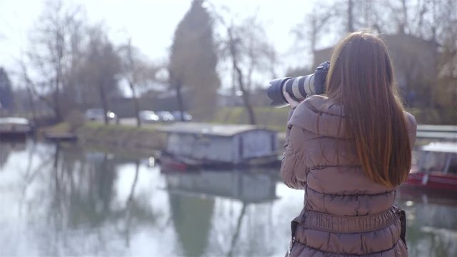 Photographer take photo by the river 4K